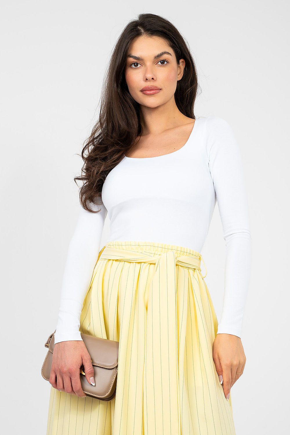 White long-sleeve blouse with scoop neckline and fitted waist silhouette