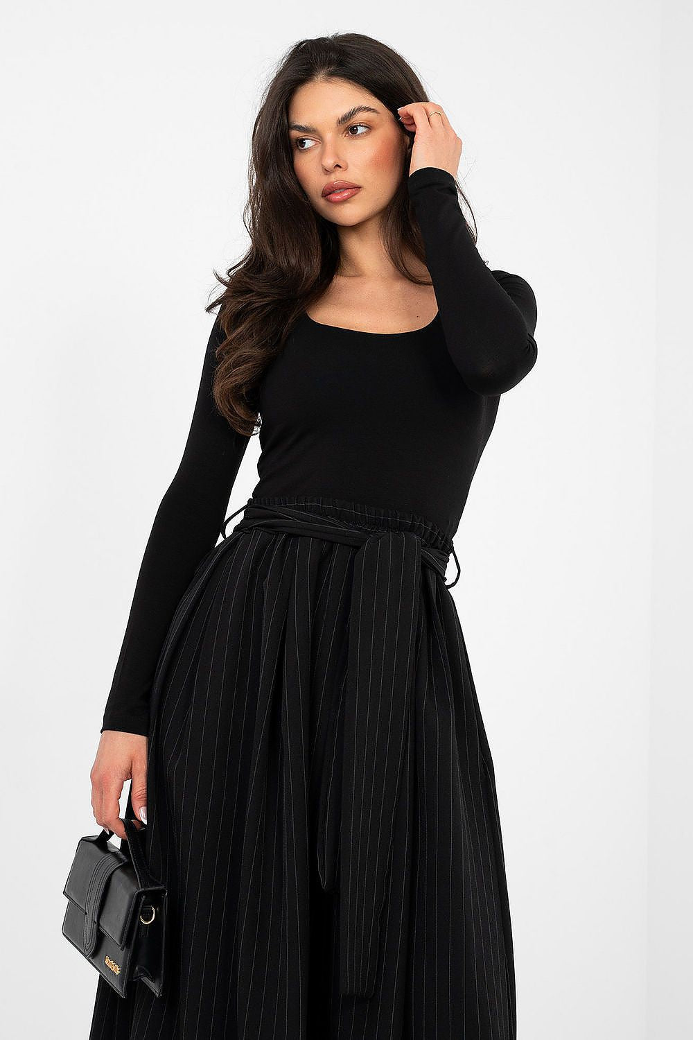 Black long-sleeve blouse with scoop neckline, fitted bodice and waist tie detail