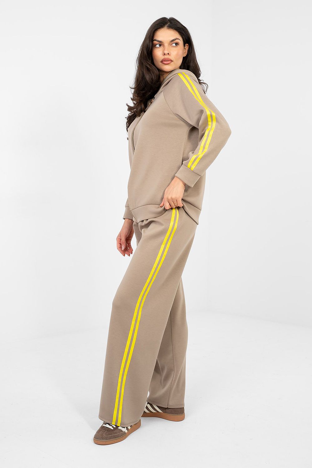 Beige track suit set side view with zip hoodie and yellow stripe pants