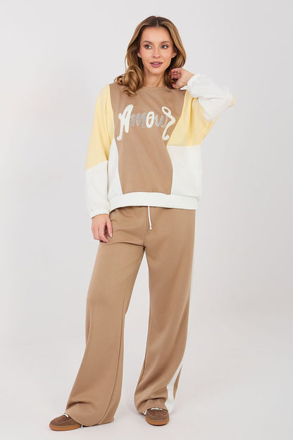 Beige sweatshirt and pants set with yellow-and-cream sleeves and wide-leg trousers