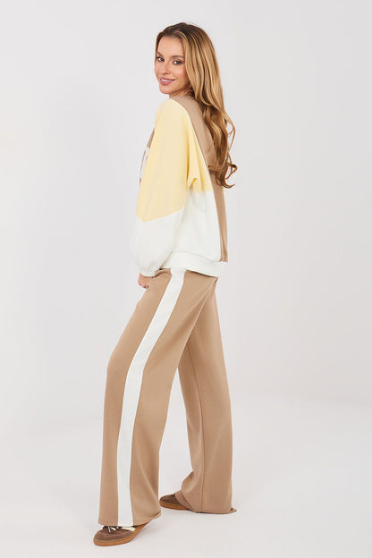 Beige sweatshirt and flared pants set with side contrast panels and warm yellow sleeves