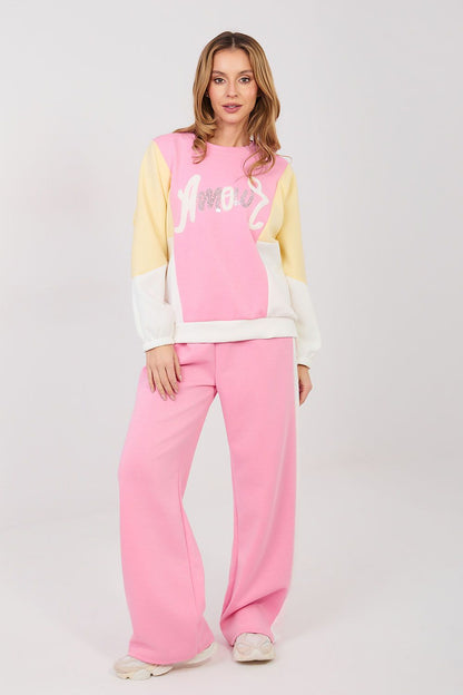 Pink sweatshirt and pants set with pale yellow sleeves and wide-leg pink trousers