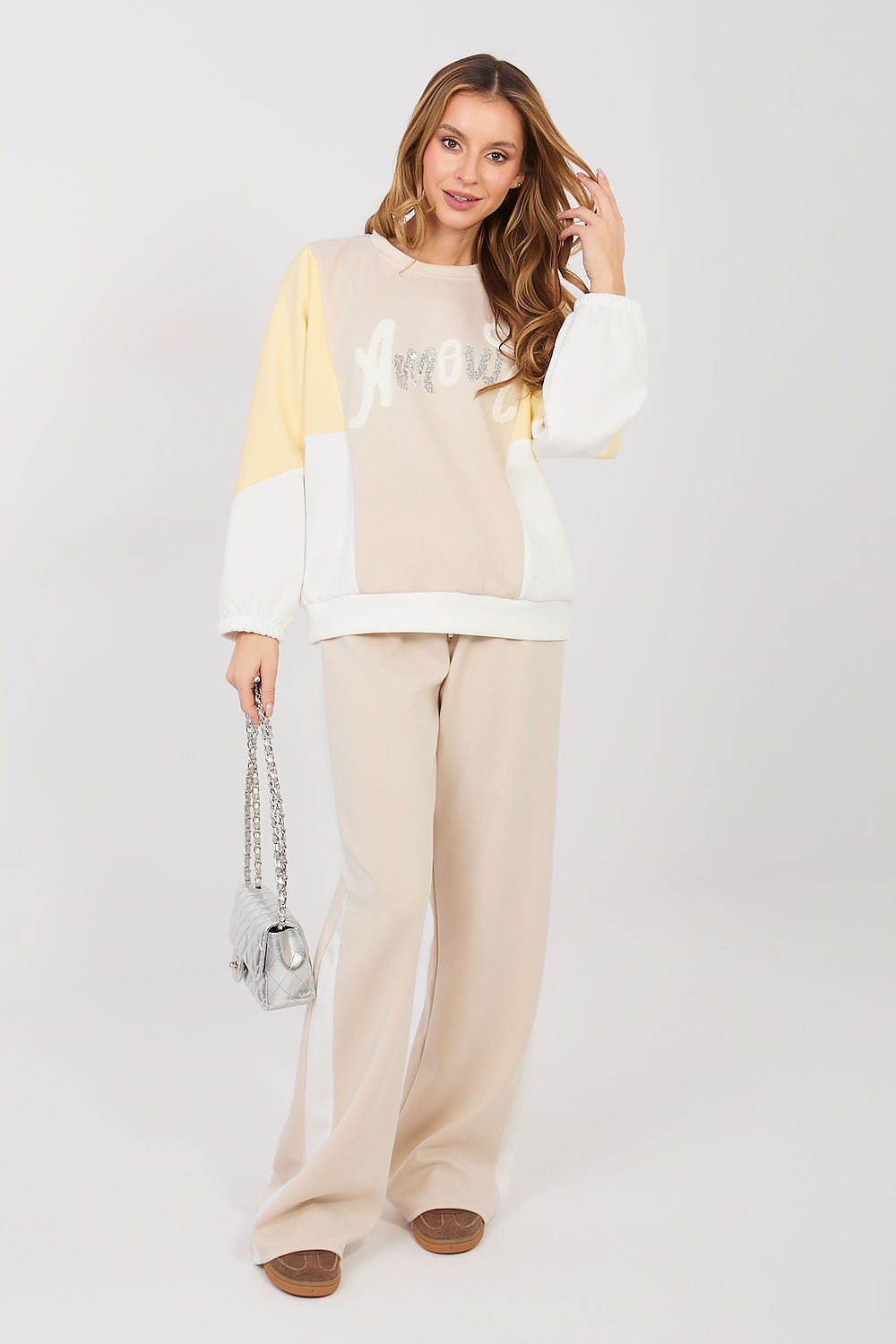 Beige and cream two-piece lounge set with long-sleeve sweatshirt and wide-leg pants