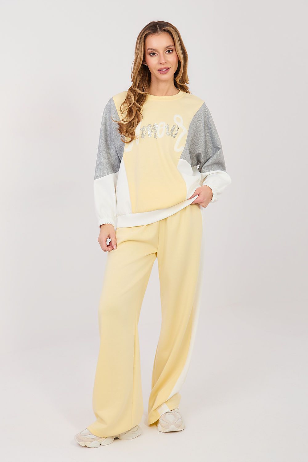 Yellow and gray two-piece lounge set with long-sleeve sweatshirt and wide-leg pants
