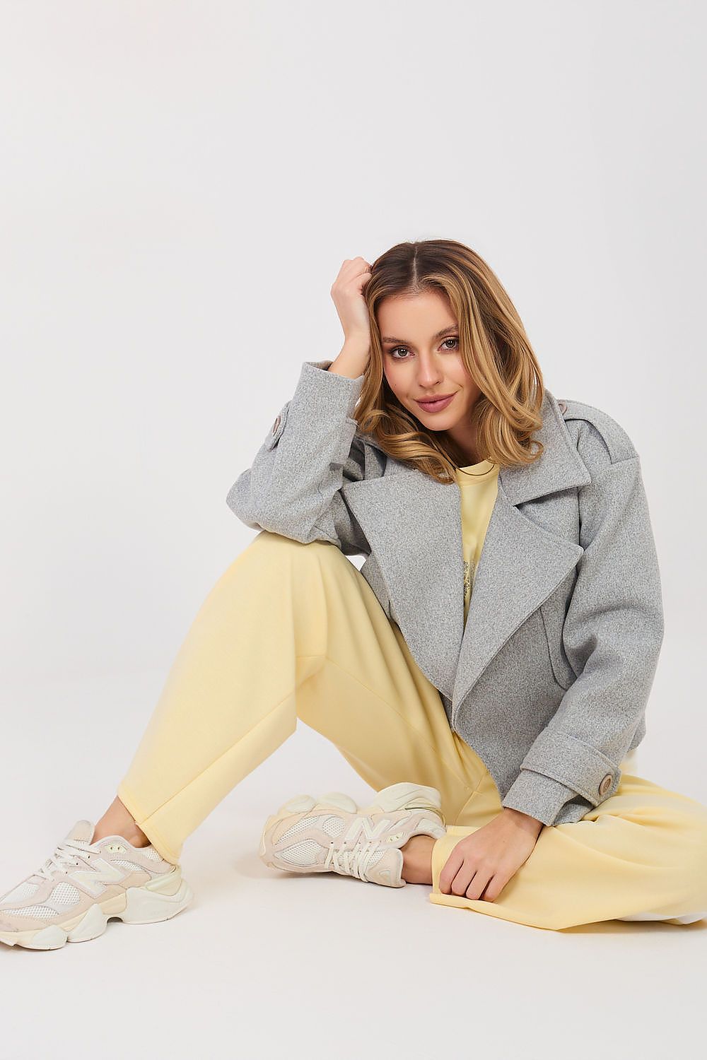 Yellow two-piece lounge set with gray jacket-style top and matching wide-leg pants