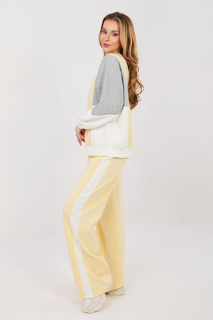 Yellow and cream two-piece lounge set with long-sleeve sweatshirt and wide-leg pants