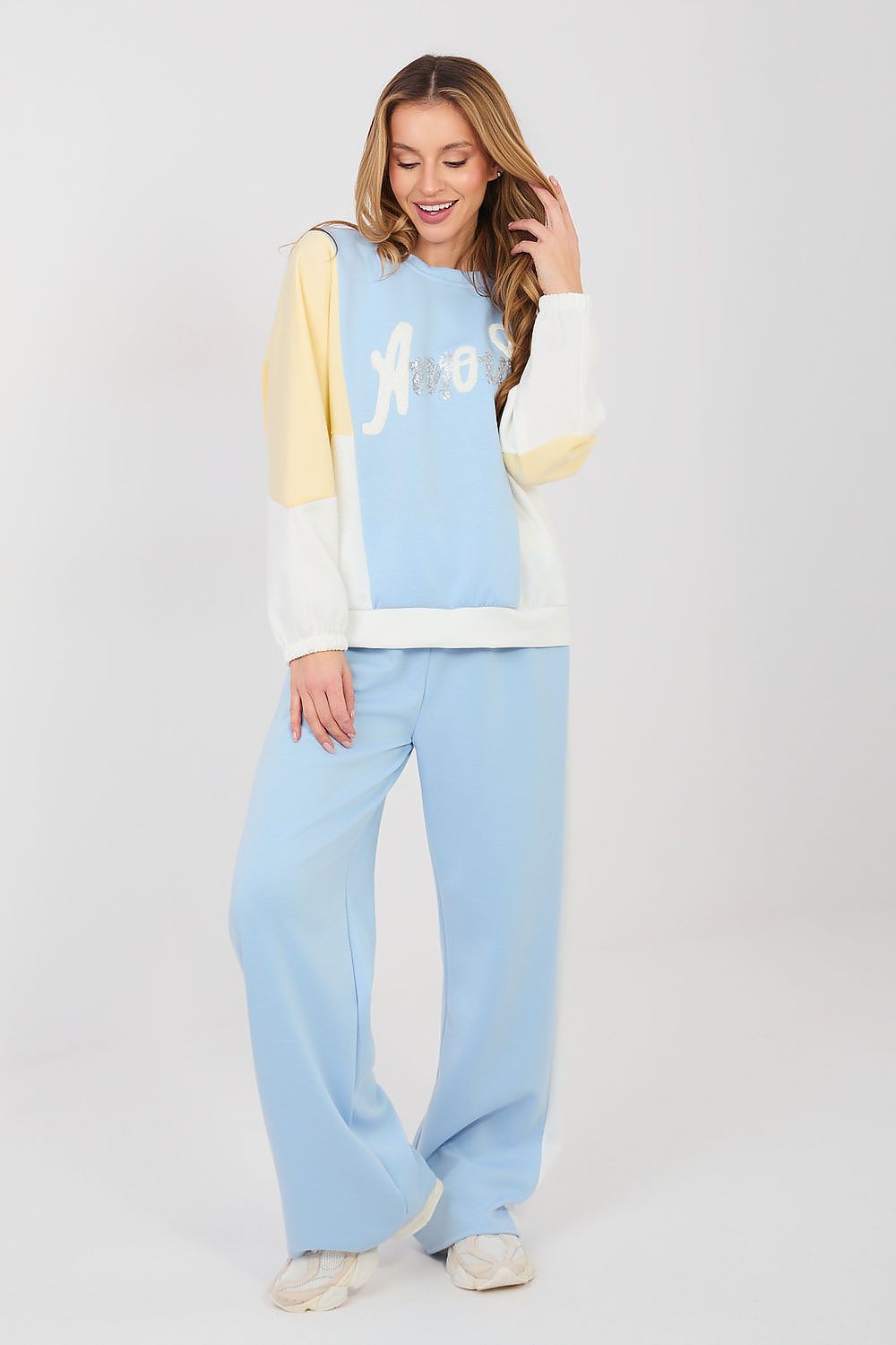 Light blue and cream two-piece lounge set with long-sleeve sweatshirt and wide-leg pants