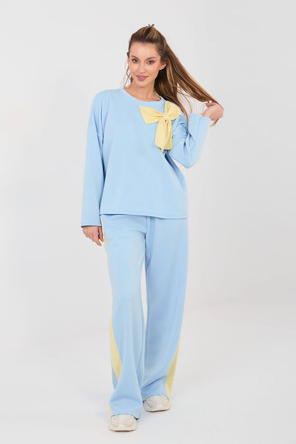 Light blue two-piece set with long-sleeve blouse and wide-leg pants, yellow bow detail