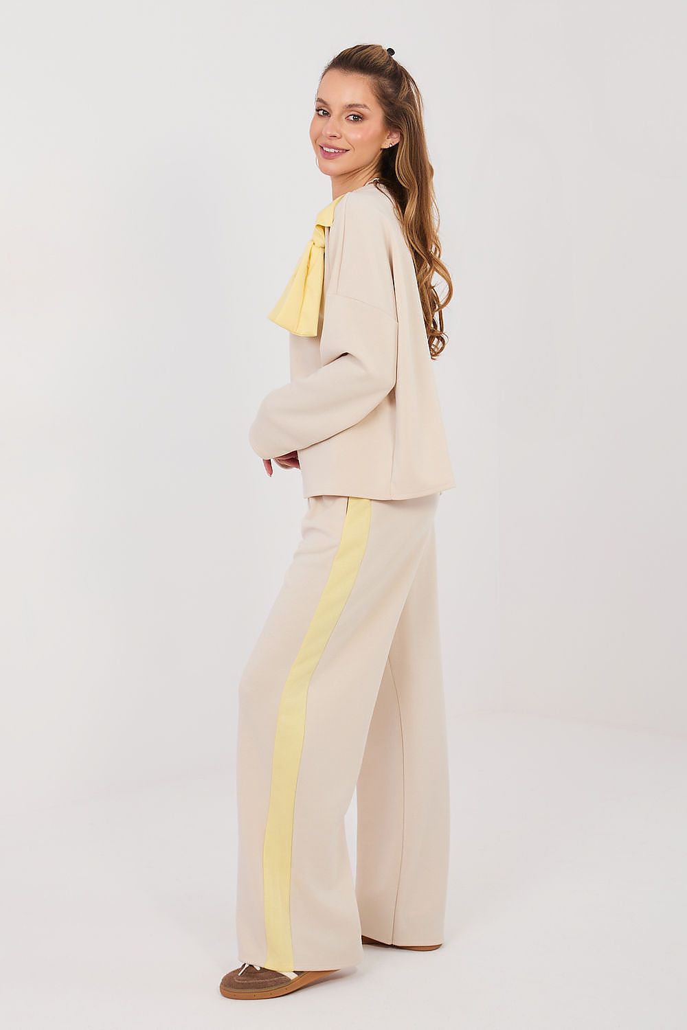 Cream pants and top set with long sleeves, bow detail and wide-leg trousers