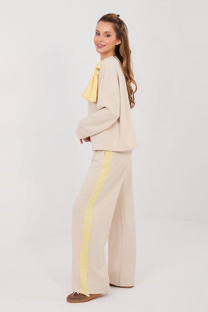 Cream pants and top set with long sleeves, bow detail and wide-leg trousers