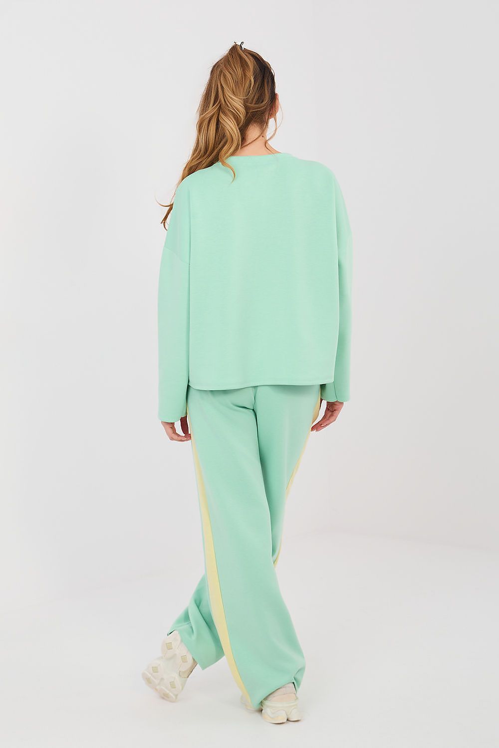Mint green pants and top set, back view, wide-leg trousers with yellow side stripe