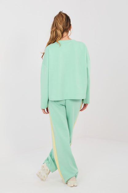 Mint green pants and top set, back view, wide-leg trousers with yellow side stripe