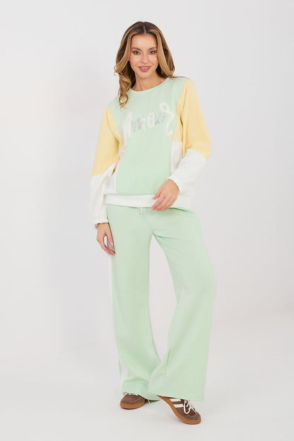 Sweatshirt and wide-leg pants set in mint-green with pale yellow contrast sleeves