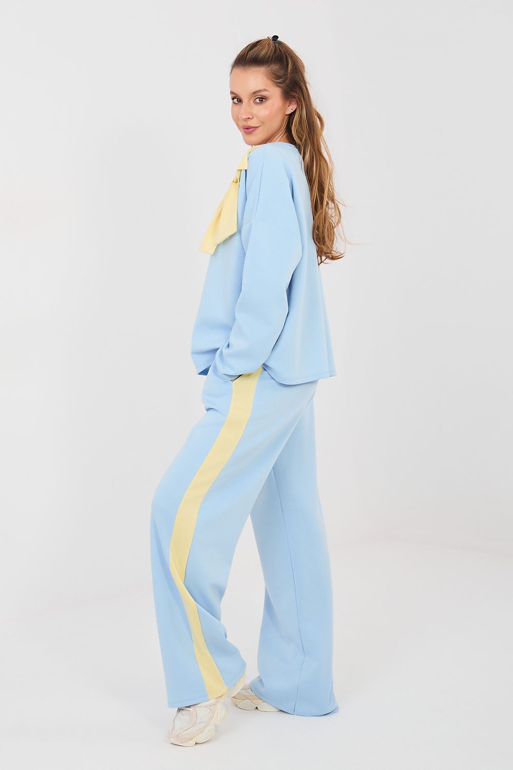 Light blue two-piece set with long-sleeve blouse and wide-leg pants, yellow side stripe