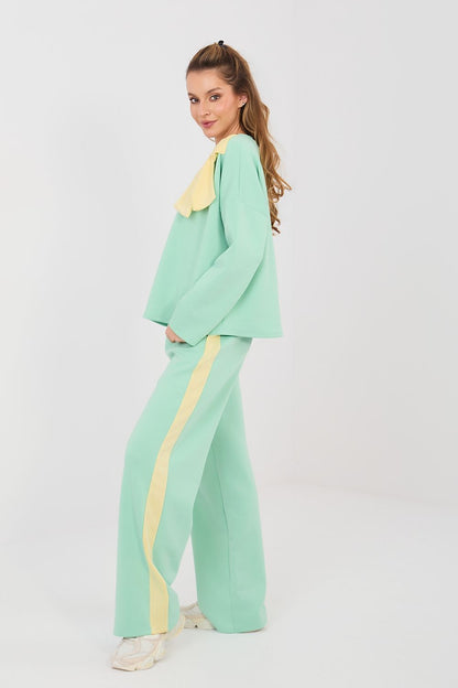 Mint green pants and top set with long sleeves, bow detail and yellow side stripe