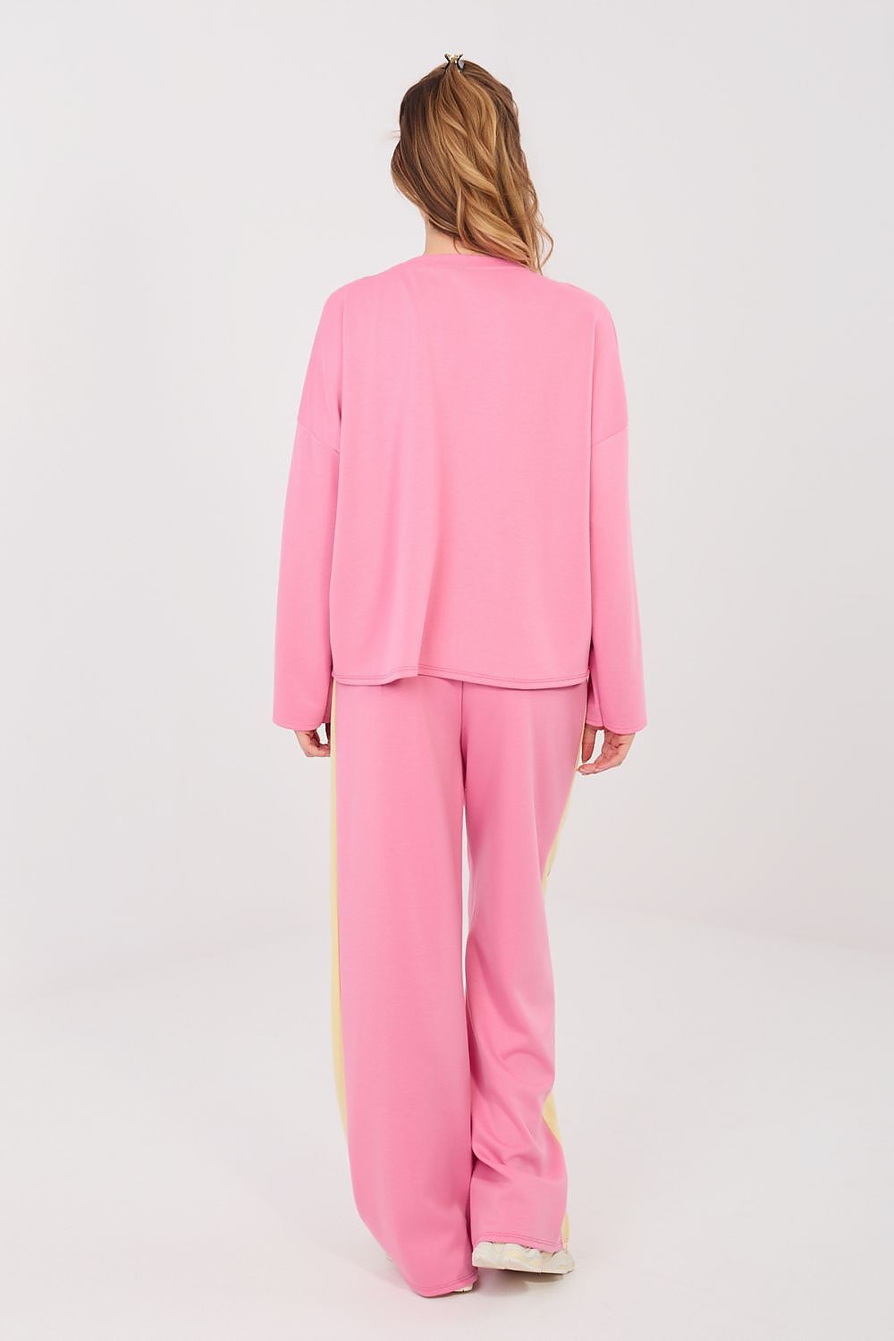 Pink two-piece set with long-sleeve top and wide-leg pants, back view
