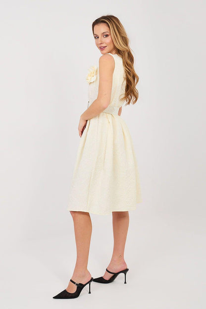 Cocktail dress side view, sleeveless fitted bodice with ruffle detail, light yellow