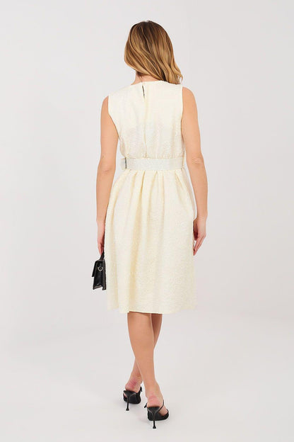 Cocktail dress back side view, sleeveless gathered waist, light yellow textured fabric