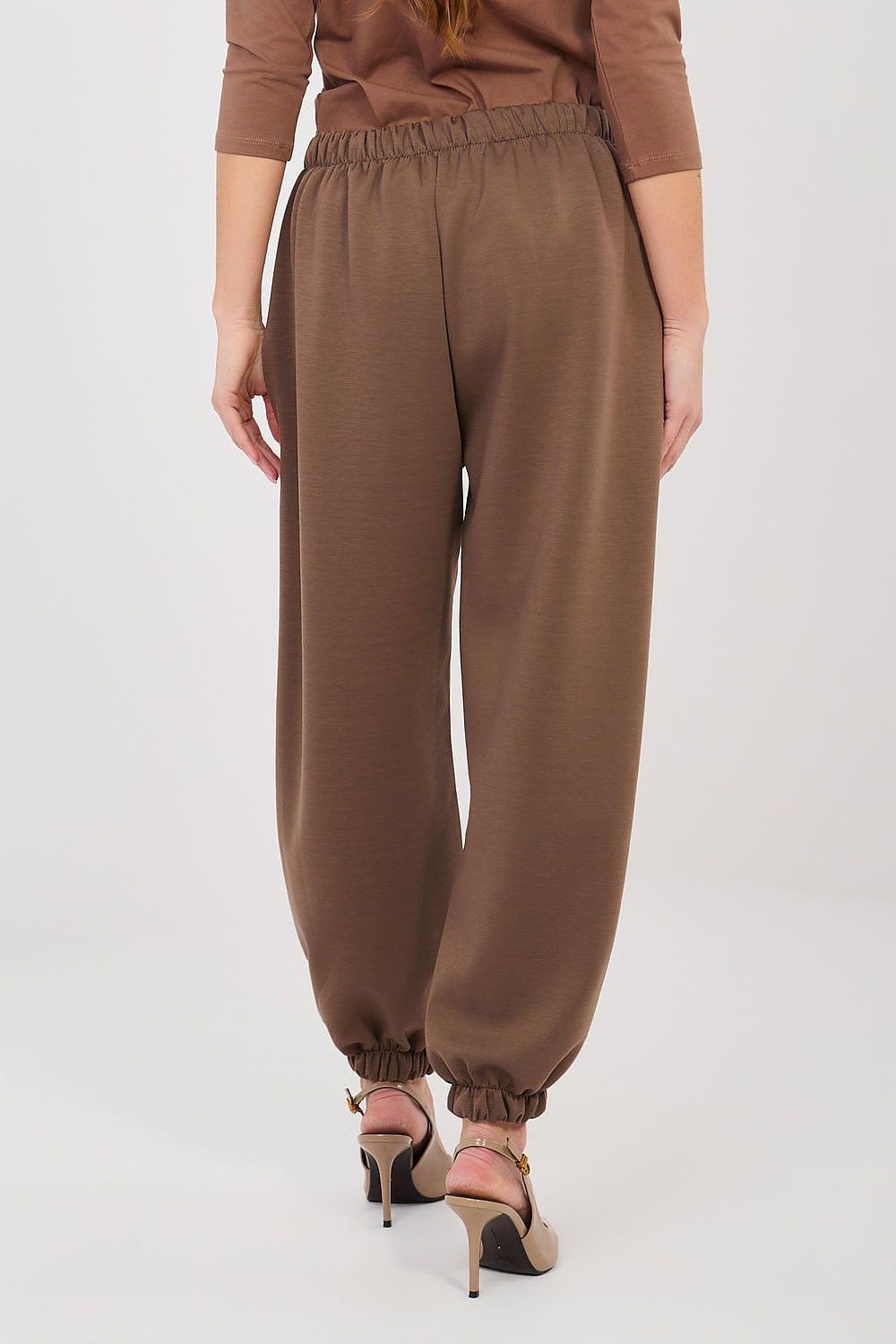 Brown tracksuit trousers with gathered elastic cuff and stitched front seam.