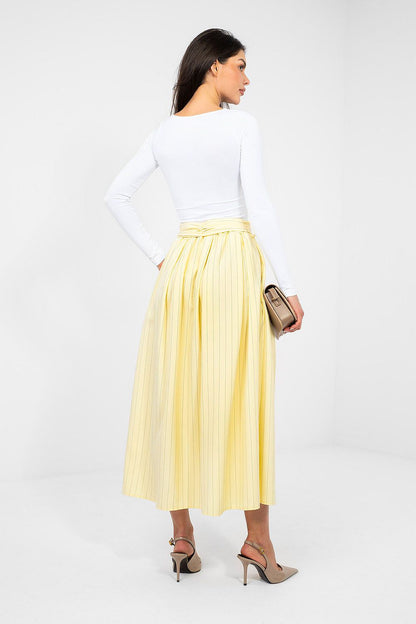 Yellow pleated midi skirt with elastic waist and tiered back hem
