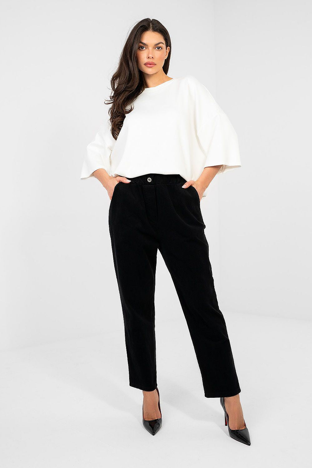Black corduroy trousers, cropped length, button-front waistband and side pockets