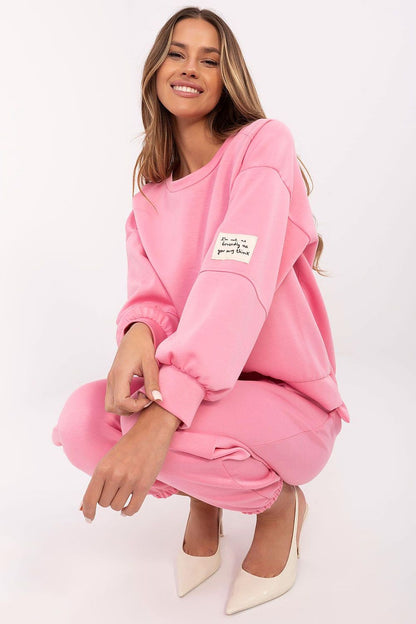 Pink sweatshirt and jogger pants with drawstring waist and ribbed cuffs