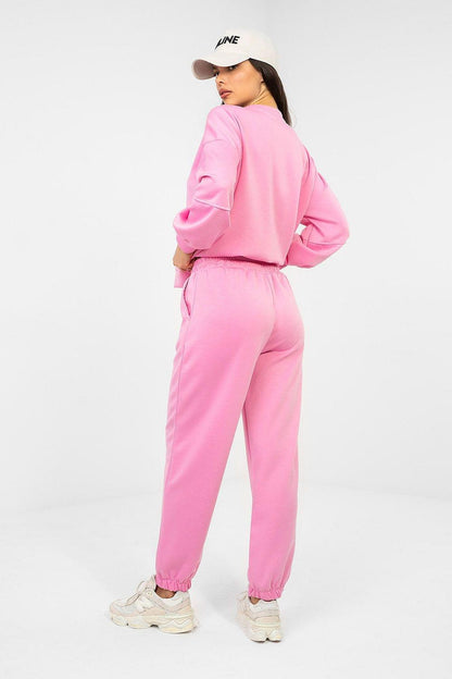 Pink sweatshirt and jogger set, back and side view with elastic hems