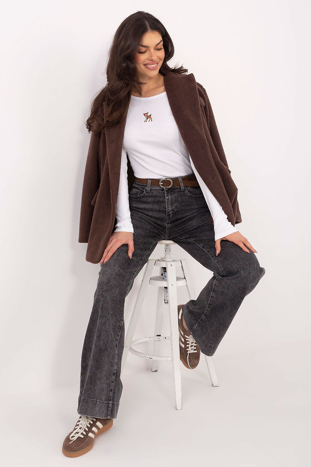White long-sleeve blouse with small chest emblem
