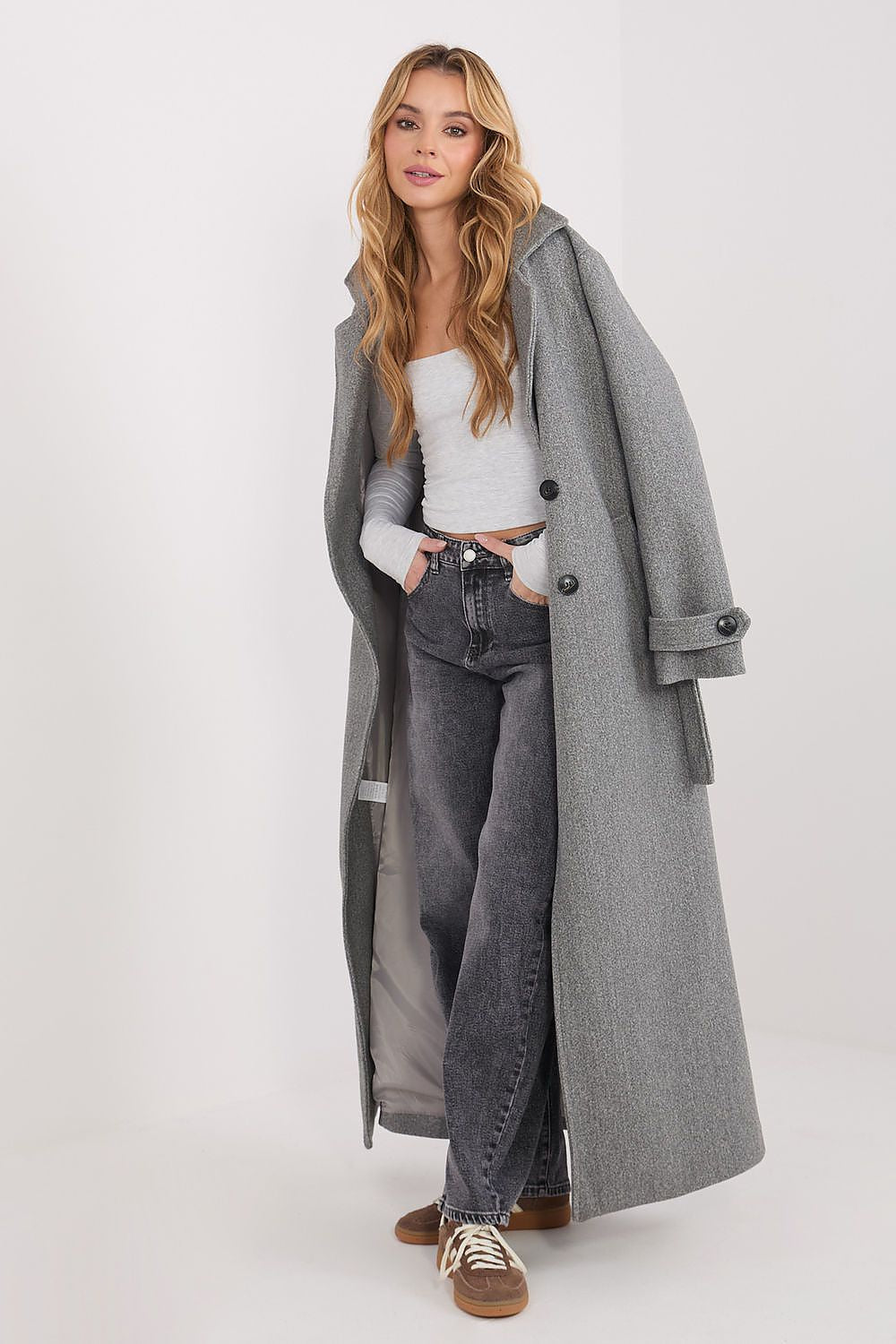 Grey long-sleeve square-neck fitted blouse under long coat