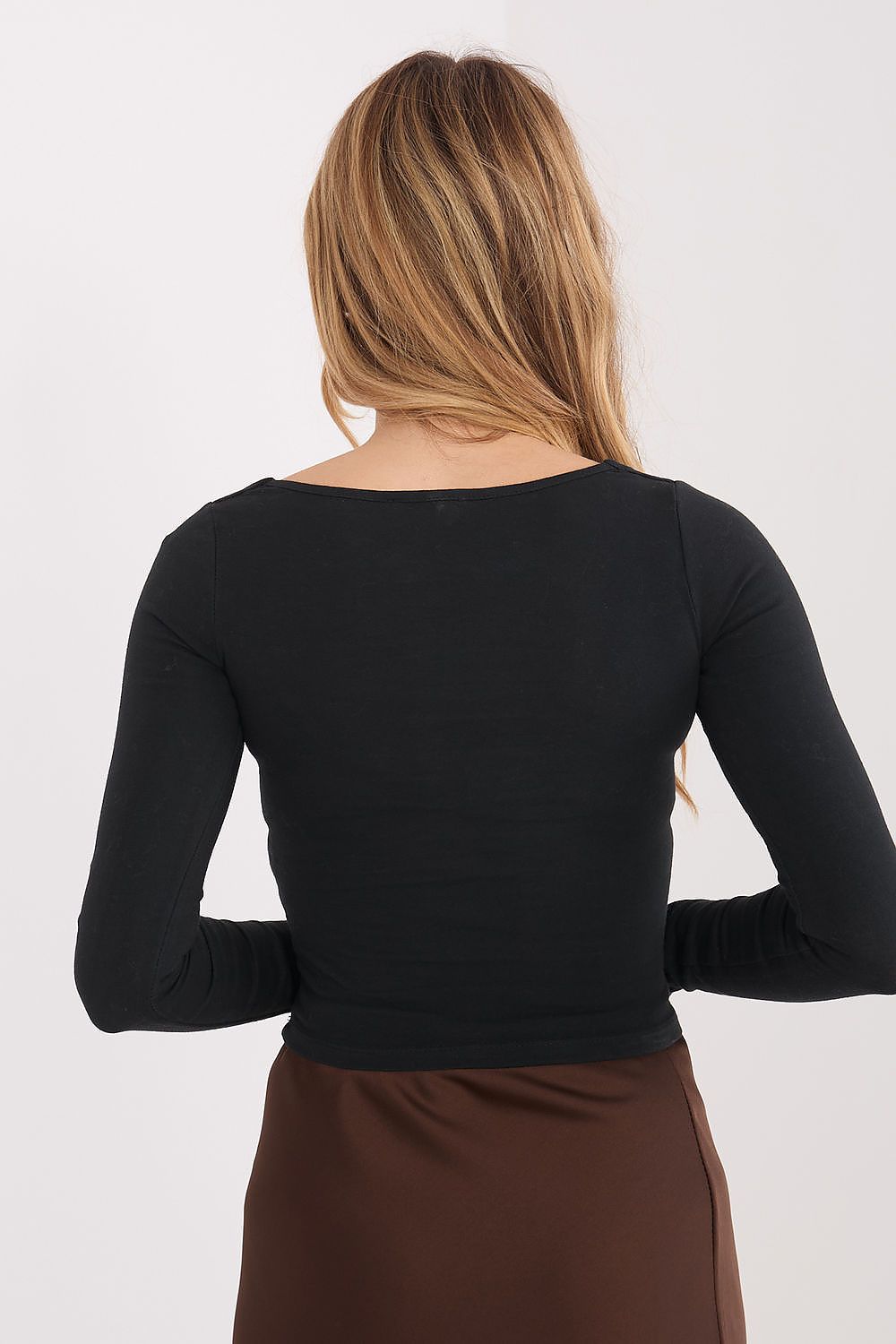 Black long-sleeve fitted blouse, back view