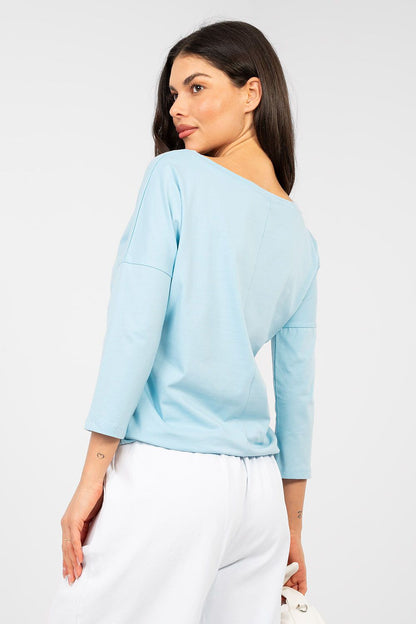 Light blue blouse with boat neckline and 3/4 sleeves, side view