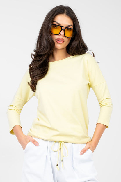Light yellow blouse with round neckline and 3/4 sleeves, relaxed fit
