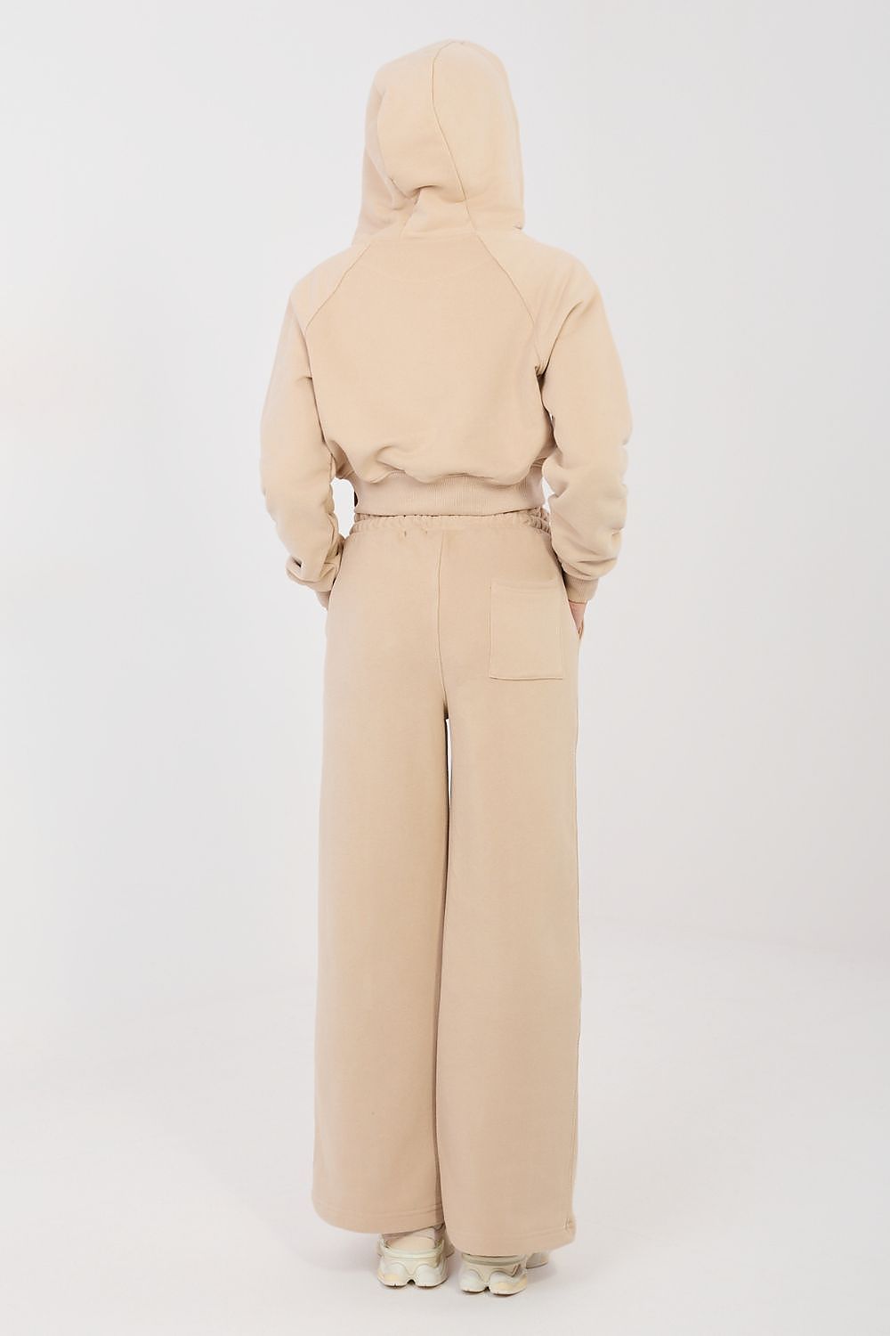 Beige back view hoodie with drawstring waist and wide-leg pants