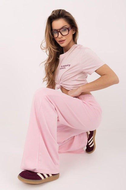 Pink wide-leg tracksuit trousers with elastic waistband, soft flowing fabric
