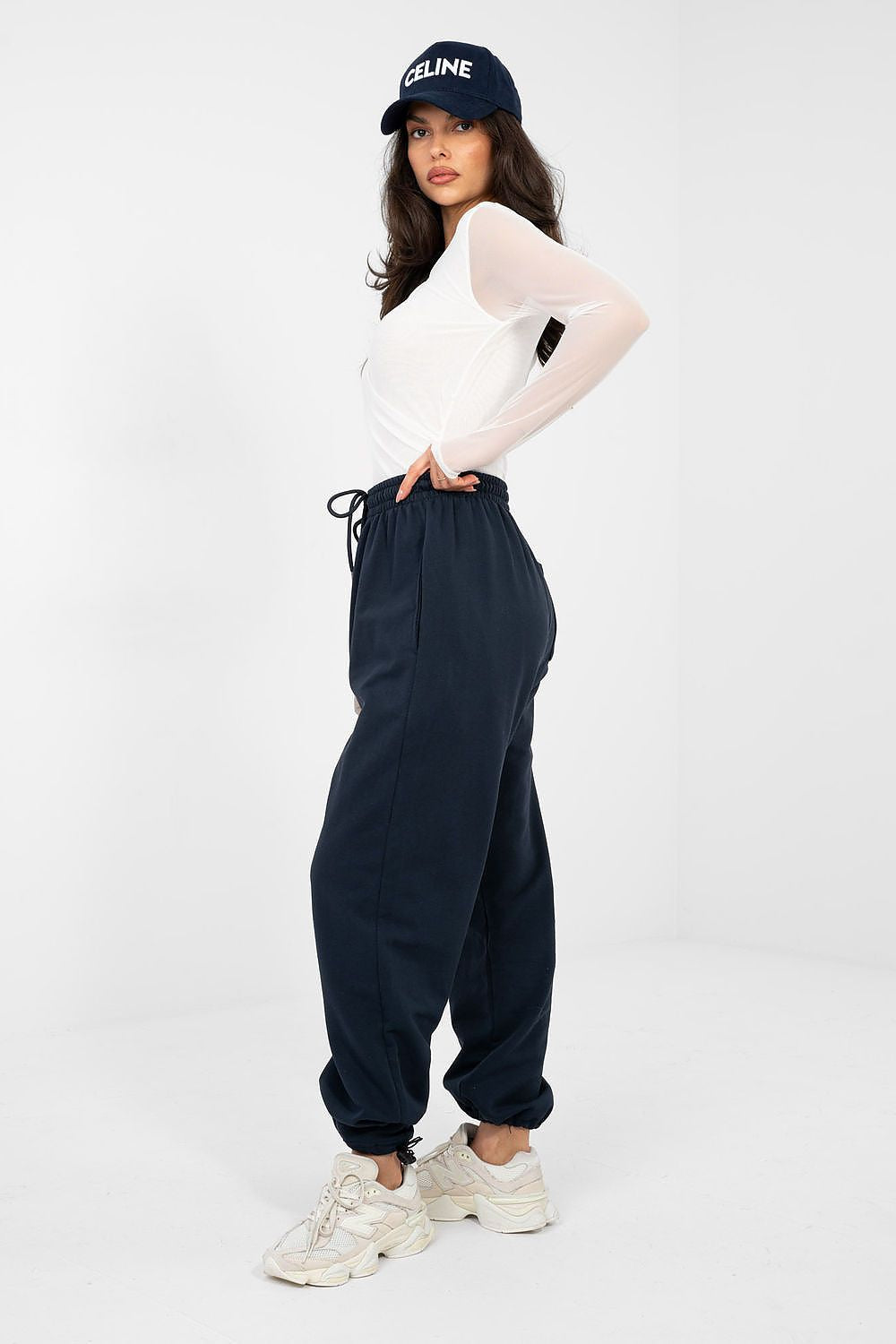 Navy blue jogger trousers with drawstring waist and gathered, cuffed ankles