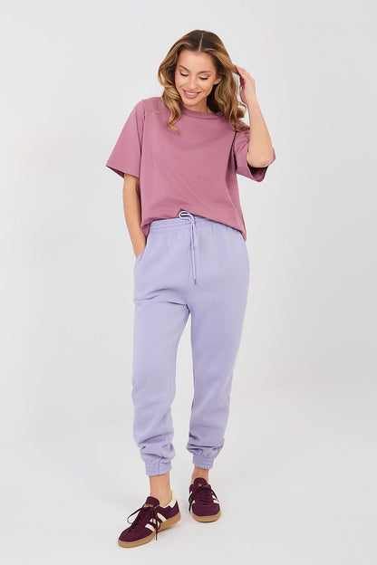 Lavender tracksuit jogger trousers with drawstring waist and tapered ankle cuffs.