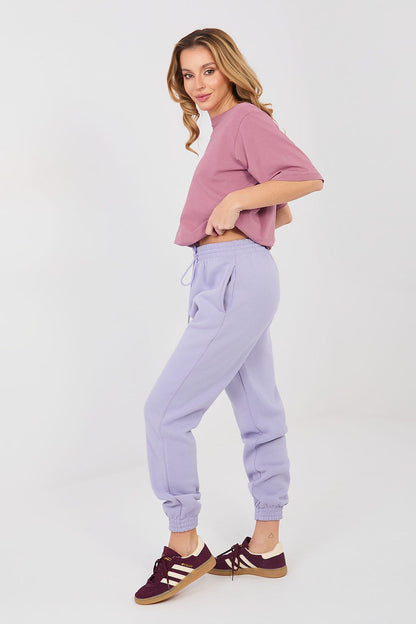 Lavender tracksuit jogger trousers, side view with drawstring waist and cuffed hem.