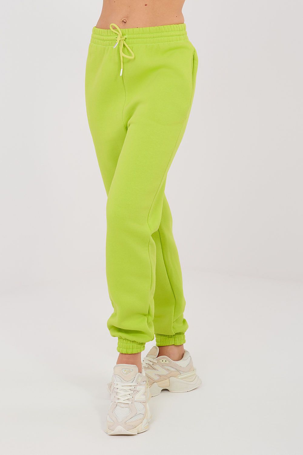 Lime green drawstring jogger trousers with elastic cuffs