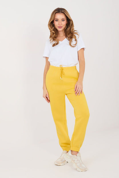 Yellow track jogger trousers with drawstring waist and elastic ankle cuffs