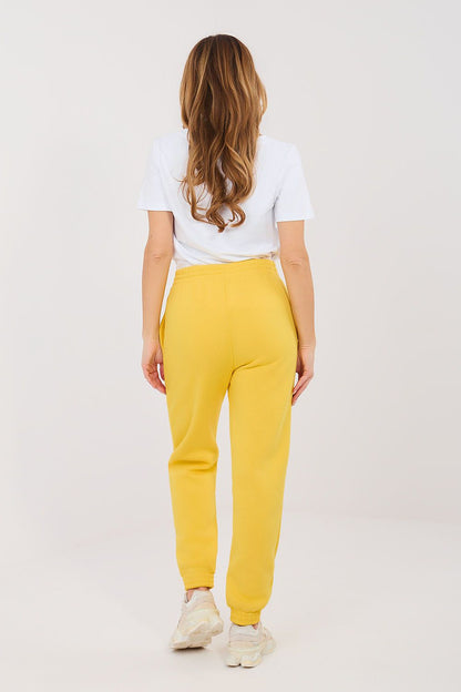 Yellow track jogger trousers with drawstring waist and elastic cuffs (back view)