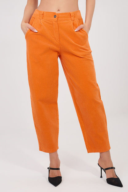 Orange corduroy high-waist trousers with button closure, side pockets, ankle cuff