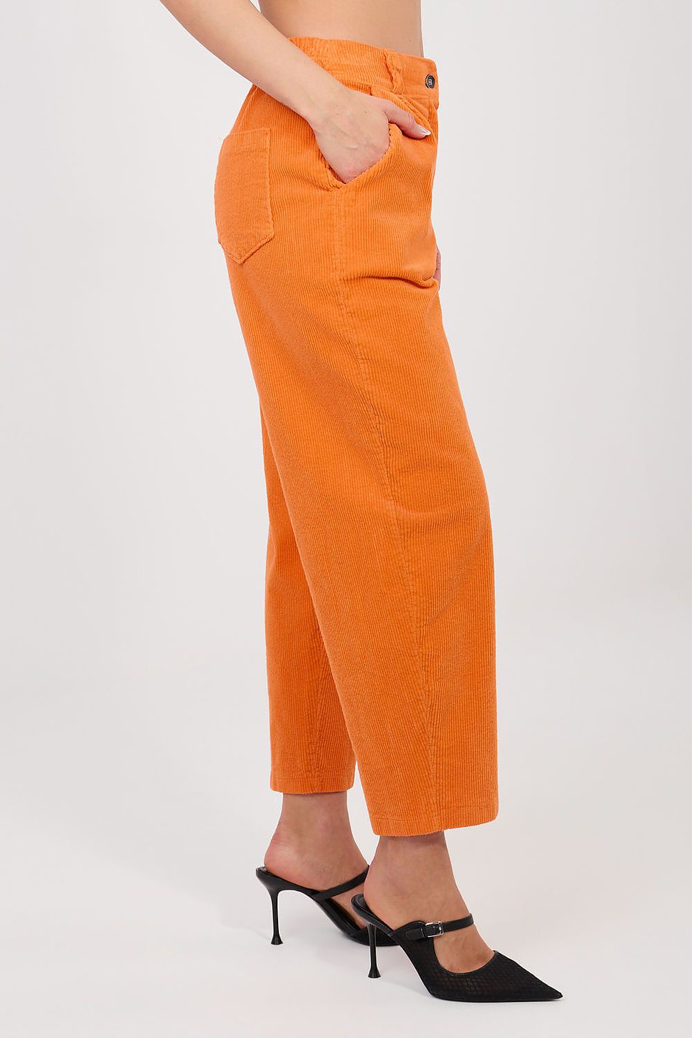 Orange corduroy trousers with button waist, front pockets, and tapered ankle hem