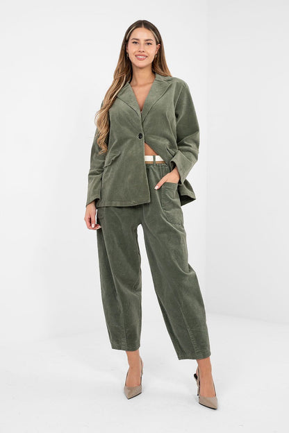 Green corduroy trousers with button front, belt loops, and side pockets.
