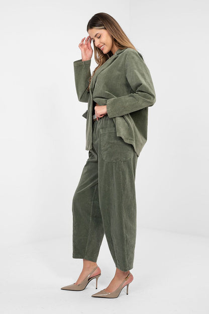 Olive-green corduroy trousers with belt loops and relaxed straight legs.