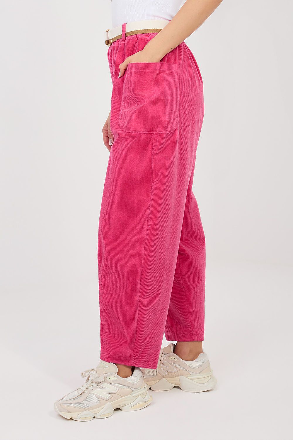 Pink corduroy trousers with high waist, belt loops, and side patch pockets.