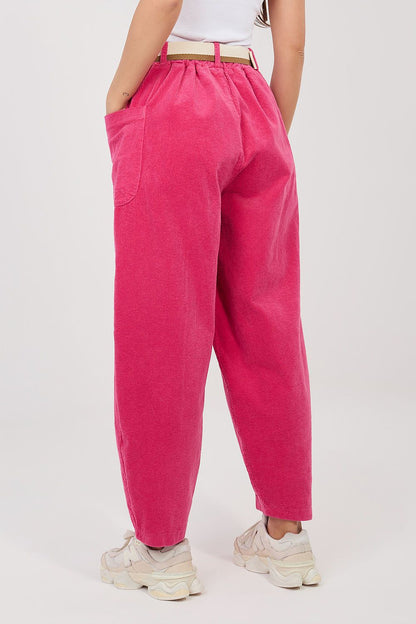 Bright pink corduroy trousers with elastic waist, belt loops, and ankle cuffs.
