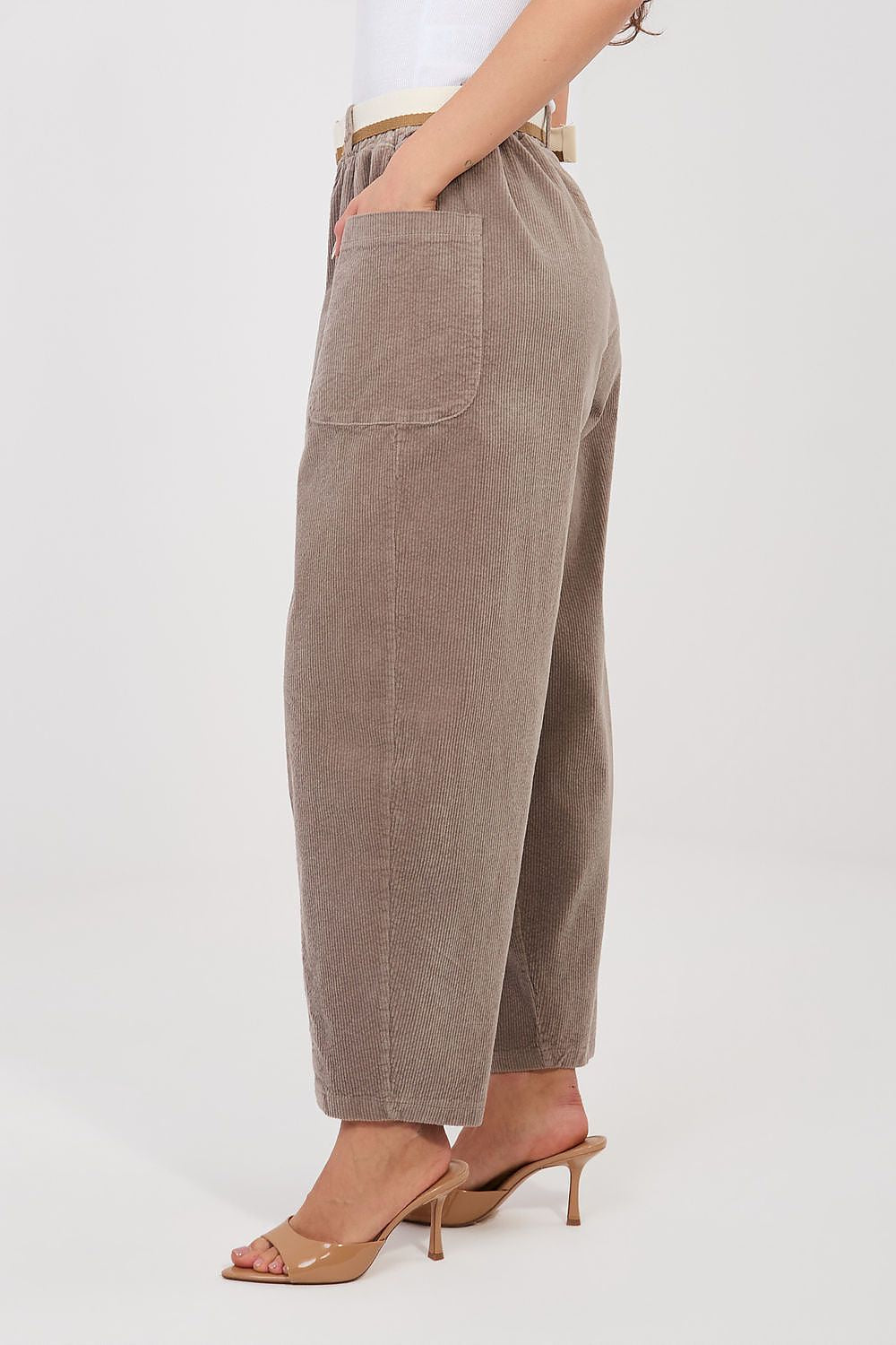 Corduroy trousers in beige corduroy, side view with belt loops and tapered legs