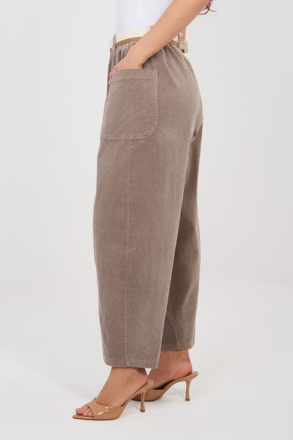 Corduroy trousers in beige corduroy, side view with belt loops and tapered legs