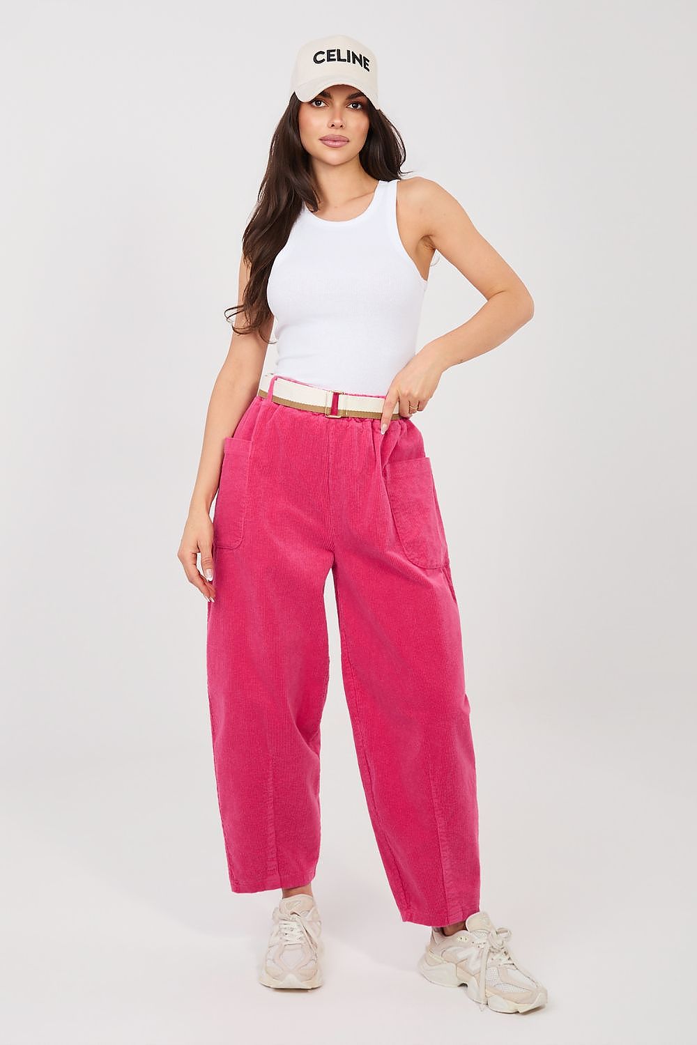 Pink corduroy trousers with high waist, belt loops, and roomy straight legs.
