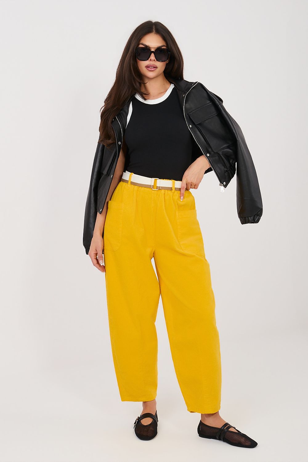 Yellow corduroy trousers with belt loops, side pockets, and ankle-length hem.